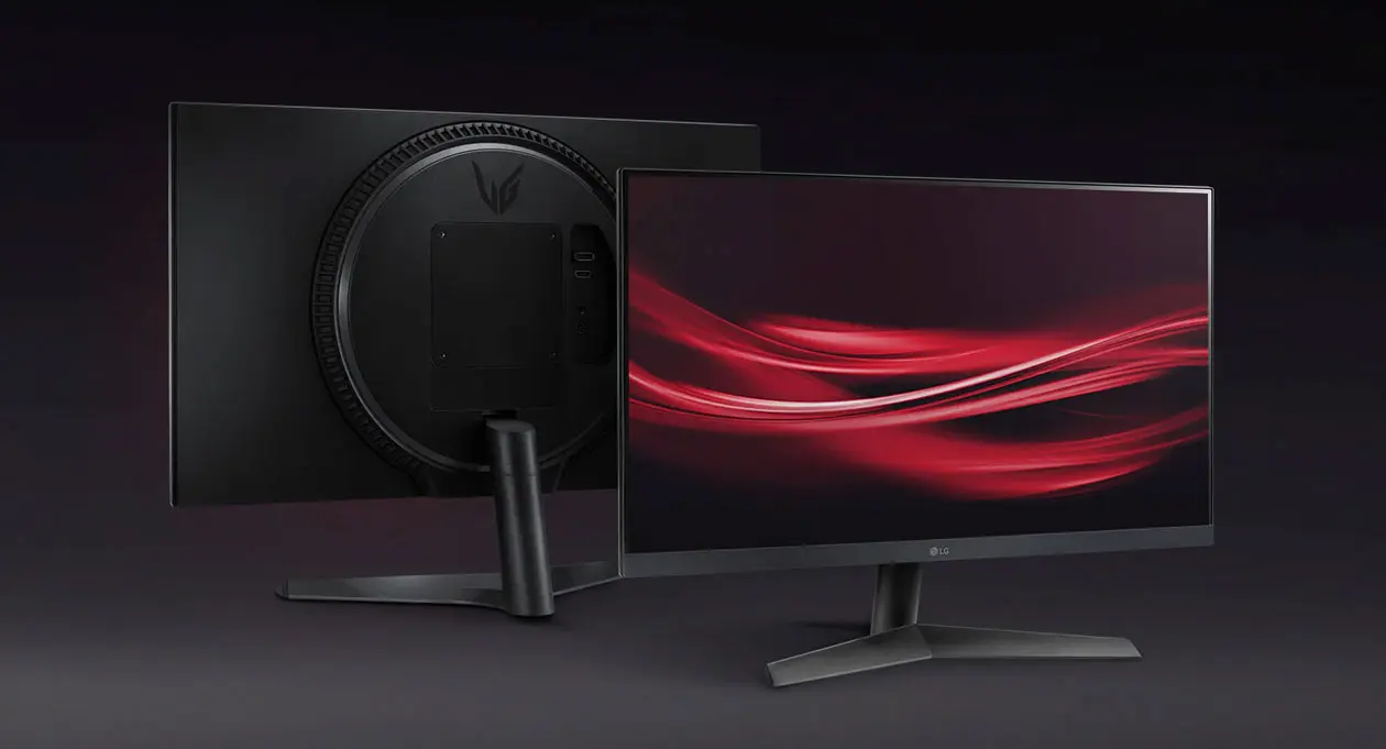 Monitor de PC Gamer com a tela passando ondas vermelhas, em fundo preto.