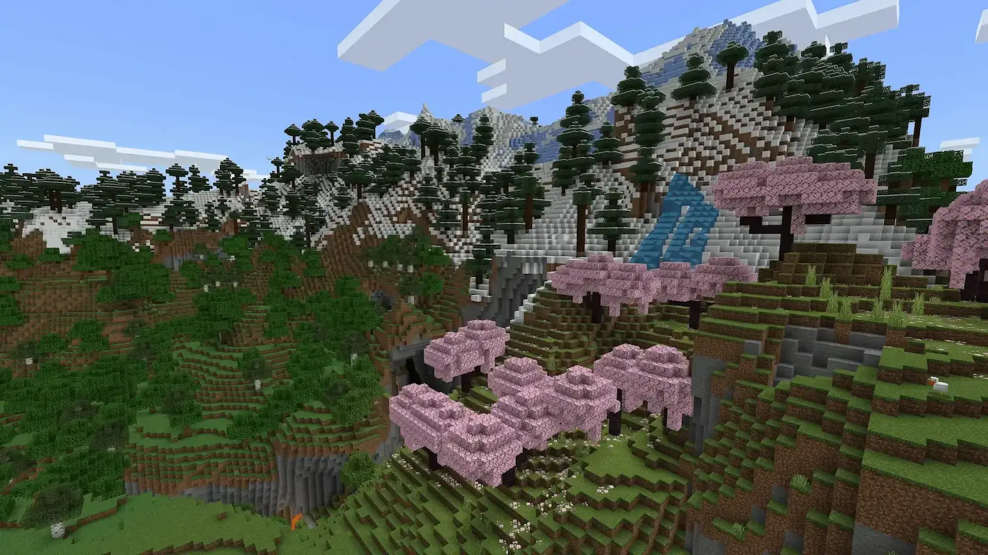 Espaço florestal dentro do mapa de Minecraft, com montanhas, árvores e riachos.
